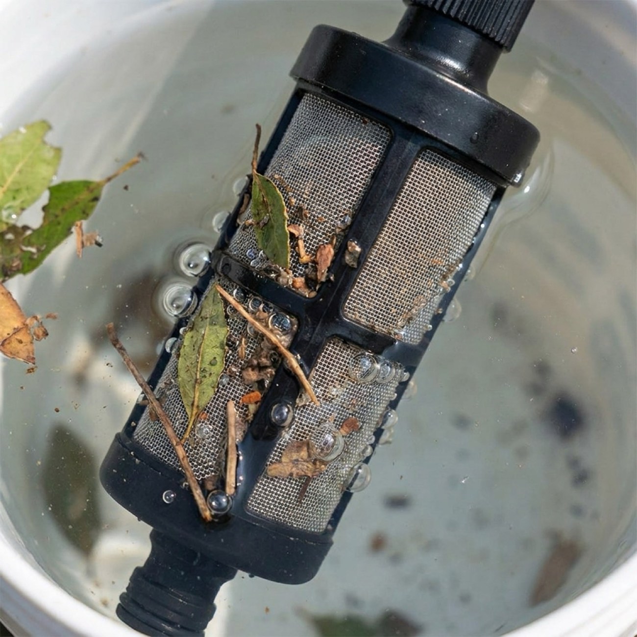 Stainless mesh filter underwater blocking sediment and particles